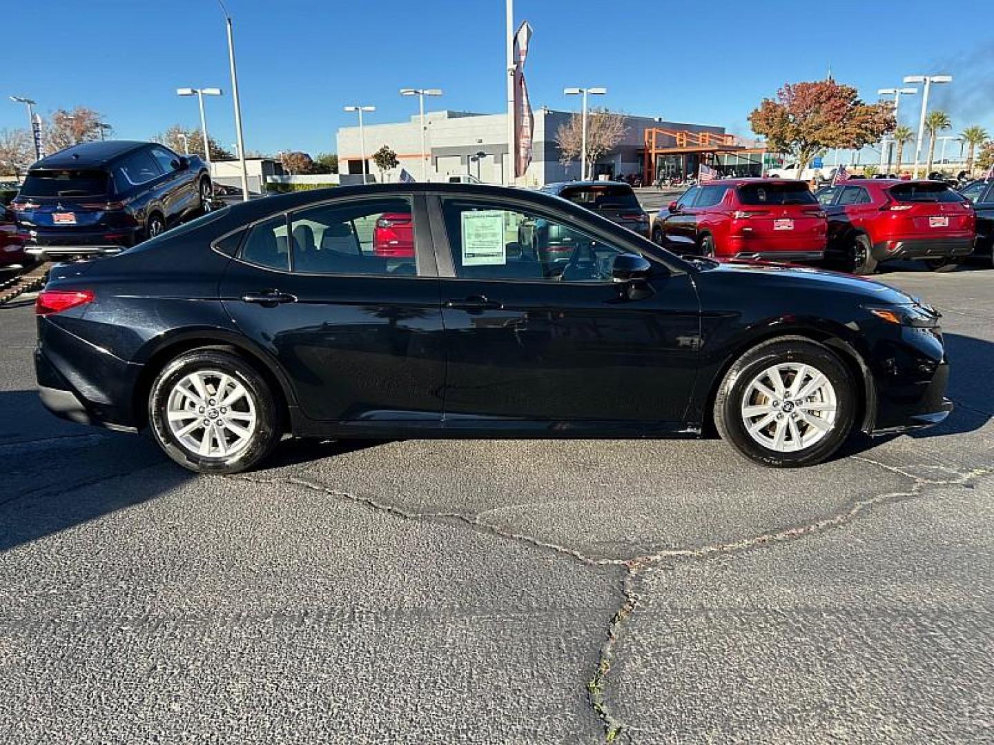 2025 BLACK Toyota Camry (4T1DAACK7SU) with an 4-Cyl Hybrid 2.5 Liter engine, Automatic CVT transmission, located at 412 Auto Vista Drive, Palmdale, CA, 93551, (661) 945-0620, 34.592636, -118.136681 - Photo#8