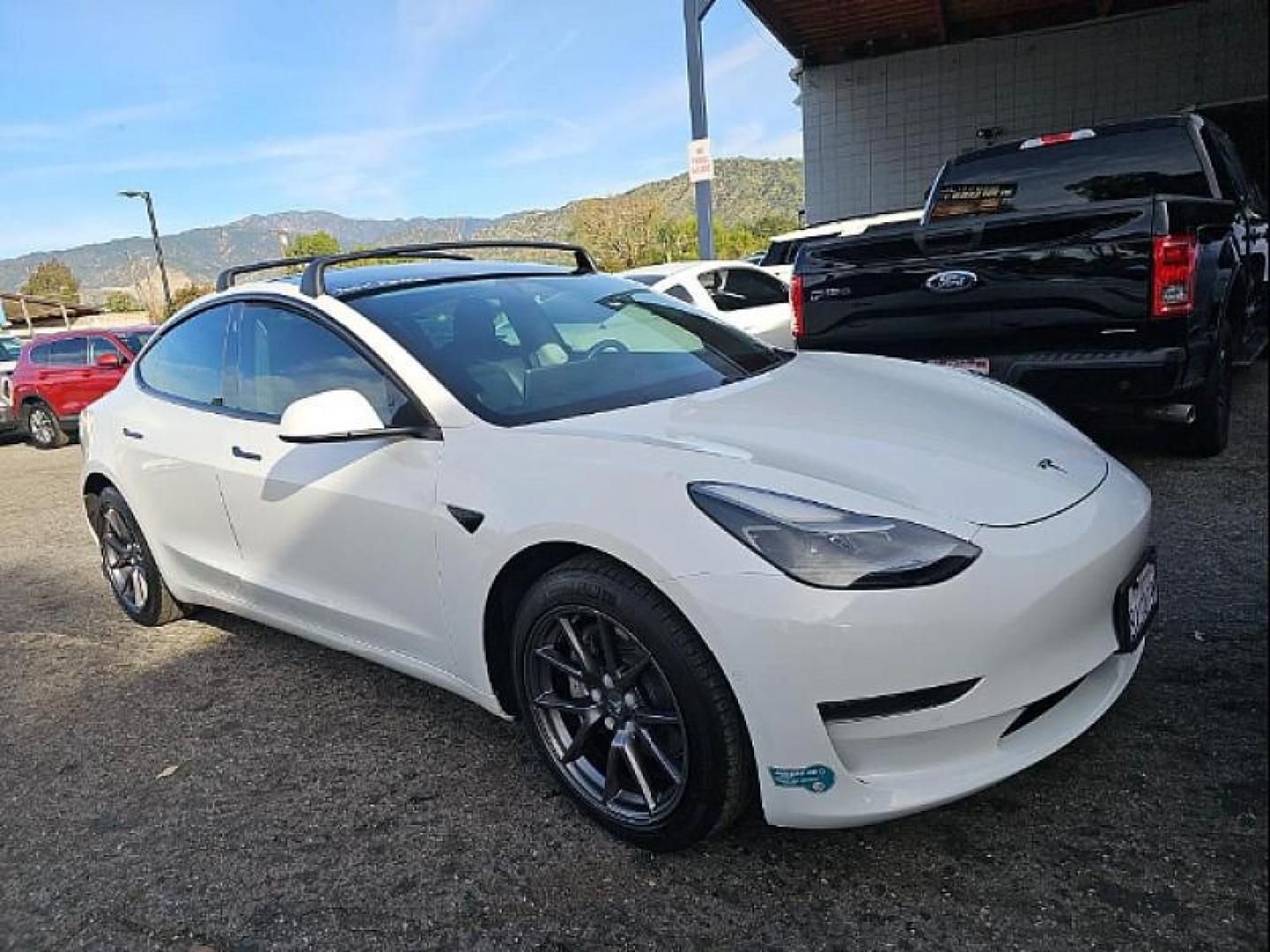 2021 WHITE Tesla Model 3 (5YJ3E1EA9MF) with an AC Electric Motor engine, Single-Speed Fixed Gear transmission, located at 412 Auto Vista Drive, Palmdale, CA, 93551, (661) 945-0620, 34.592636, -118.136681 - Photo#1