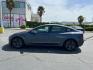 2023 GRAY Tesla Model 3 (5YJ3E1EA2PF) with an AC Electric Motor engine, Single-Speed Fixed Gear transmission, located at 412 Auto Vista Drive, Palmdale, CA, 93551, (661) 945-0620, 34.592636, -118.136681 - Photo#7